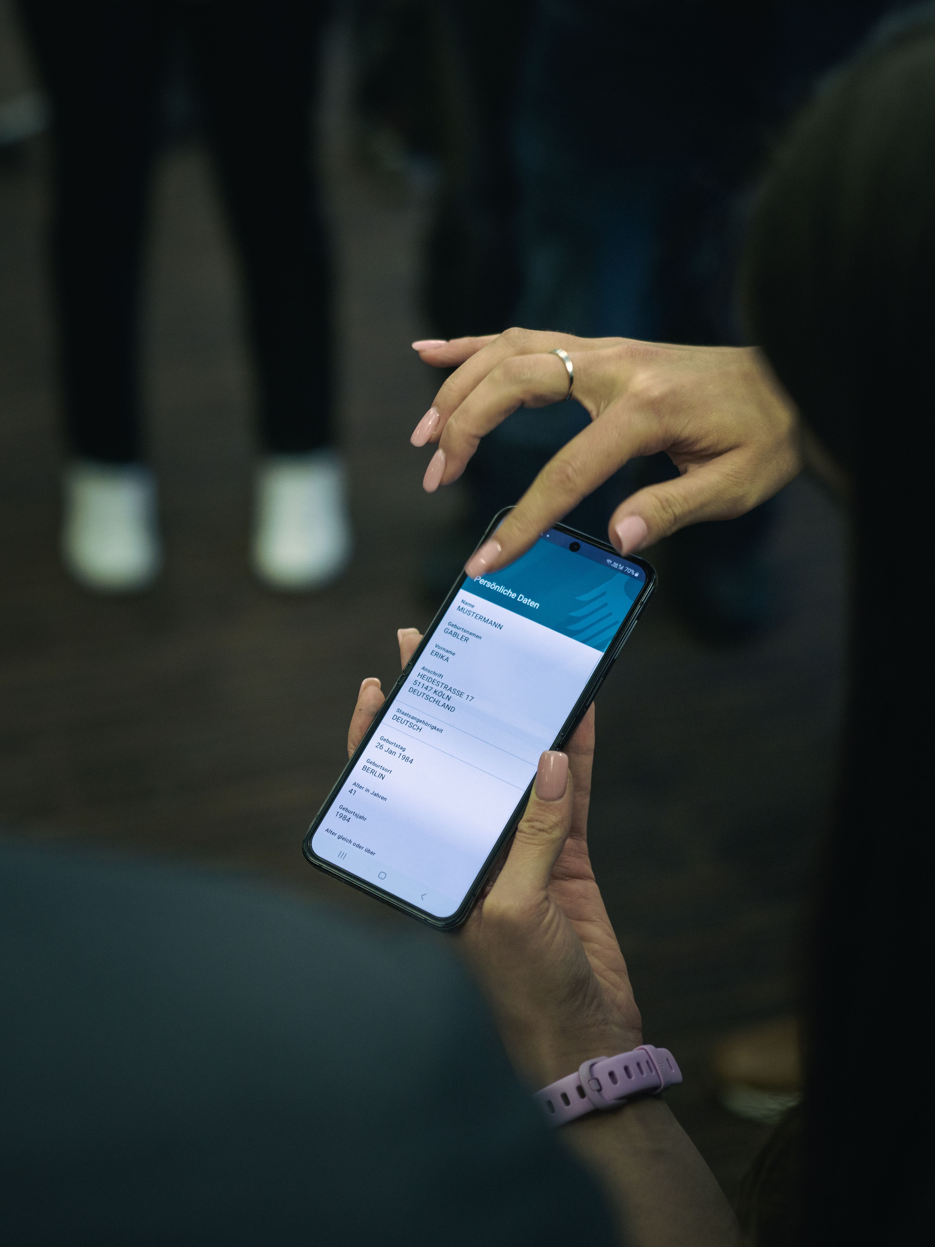 Picture of a person's hands navigating on a smartphone