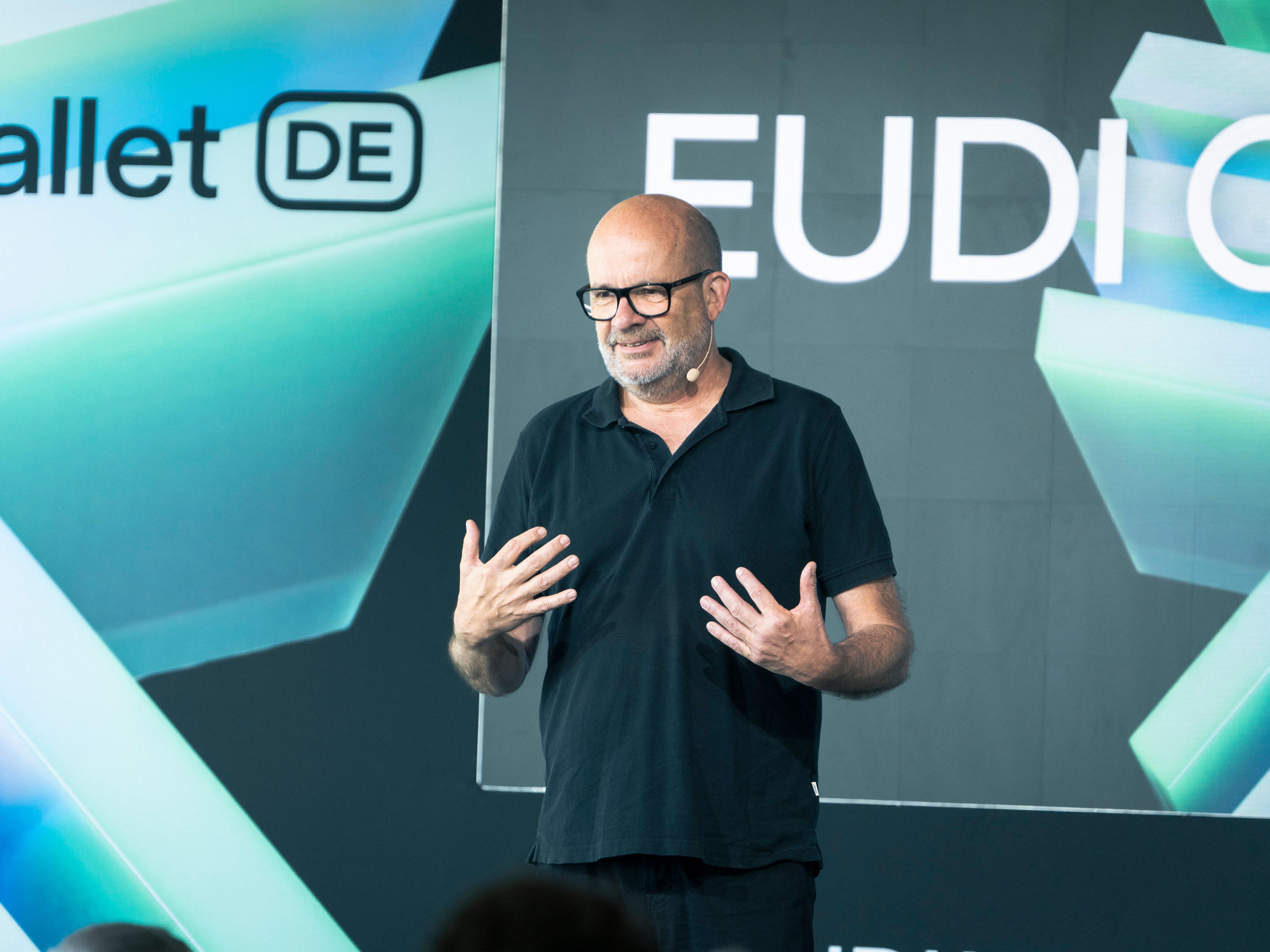 Person speaking on stage at EUDION 2026 in front of a screen with EUDI Wallet branding